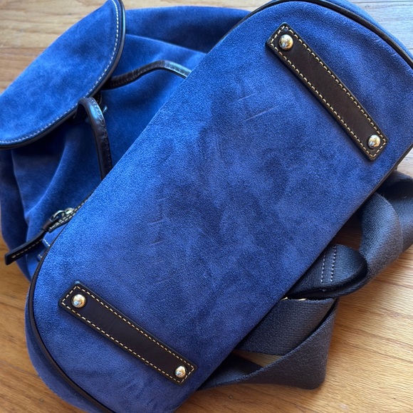 blue backpack brown leather Sloan Mini - Slim Design, Built-In Sleeve Fits 11" iPad - Navy duty canvas body and leather trim resist everyday wear and keep the bags shape Canvas & Leather Backpack